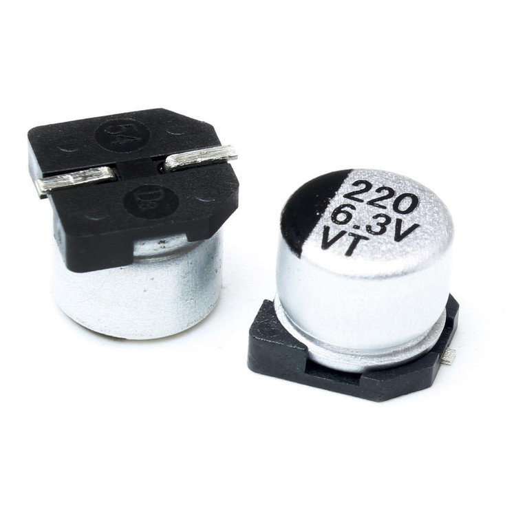 خازن الکترولیتی SMD 220uF 6.3V سایز ES - نمای نزدیک با علامت منفی و مشخصات